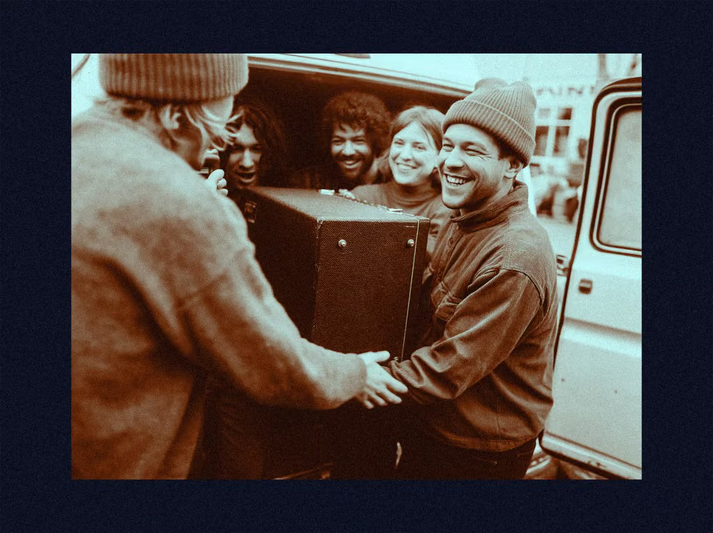 Band loading gear into a van